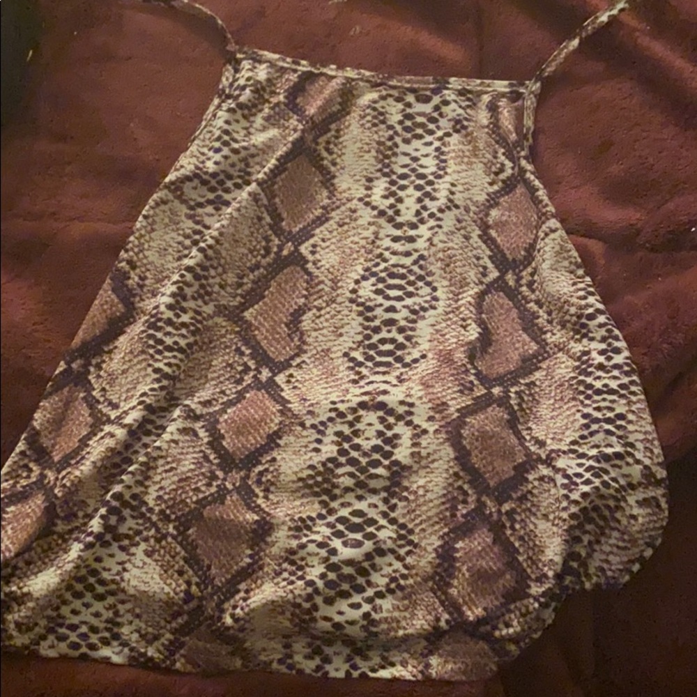 this is a snake print open back shirt from shein